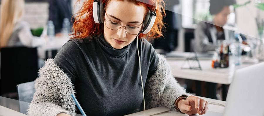 Person listening to music to focus while they work